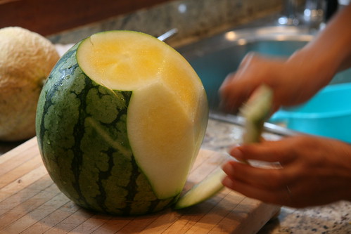 peeling a yellow watermelon