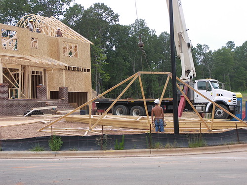 Putting trusses on a newly framed home