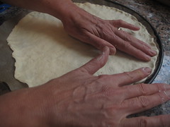 Stretching out pizza dough