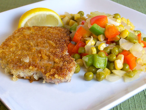 Asiago-Crusted Pork Chops with Sweet Pea and Pepper Toss