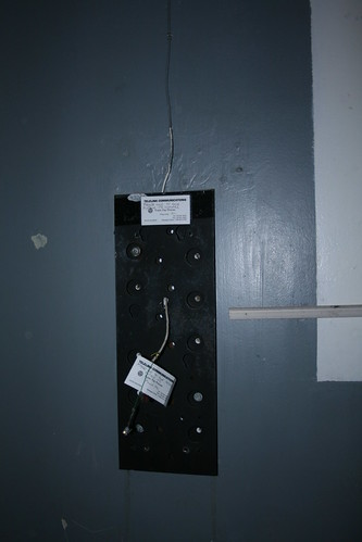 Wall mount bracket for a payphone