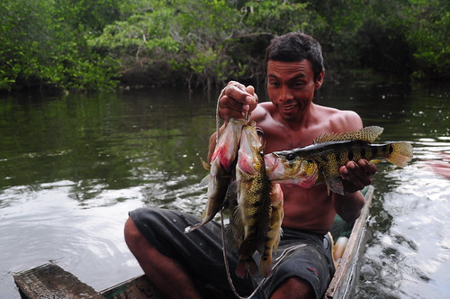 A Mayan fisherman shows us his catch which he got using just a string and a piece of bait.