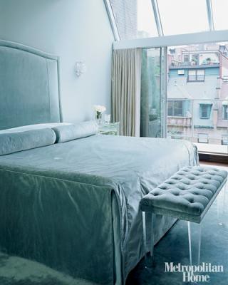Luxe blue bedroom: Velvet headboard + tufted lucite bench, from Met Home