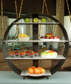 Round wheel buffet stand with glass plates and glass bowls for fruits and desserts for buffet ideas