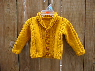 Ravelry: Heirloom Cables Baby Sweater pattern by Lion Brand Yarn