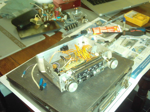 the amp mounted in the case with the front panel reattached
