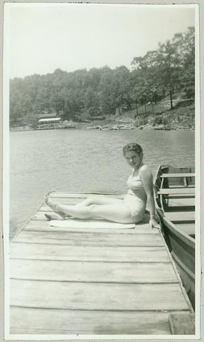  girl on dock with two piece bathing suit
