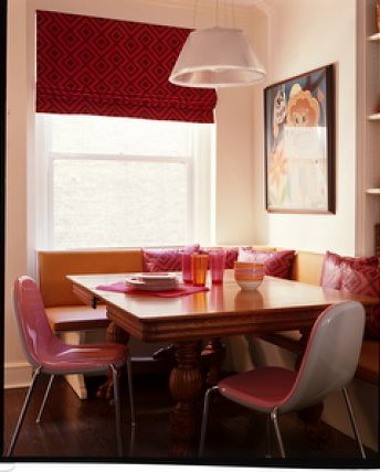 Pink in the kitchen: Banquette seating + modern pink chairs