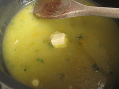 Lemon thyme curd cooking with butter cubes