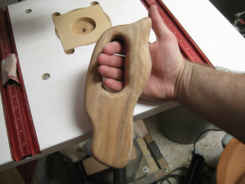 hand in homemade saw handle
