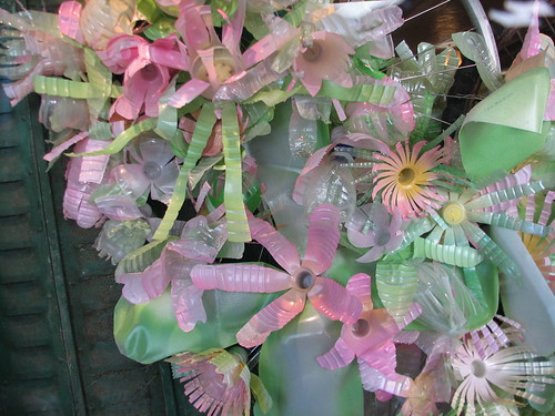 The window display at Anthropologie was made with plastic bottles cut and painted to look like flowers