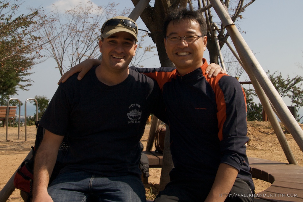 Griffin and Mr. Choi resting at the top of the mountain.