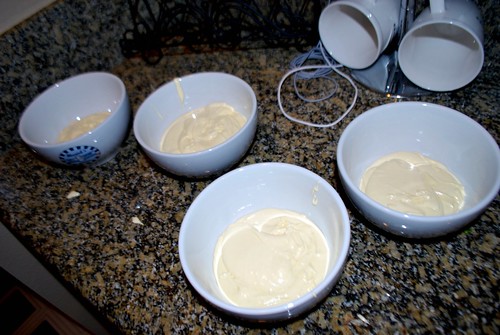 Placing the cake batter in different bowls for colors