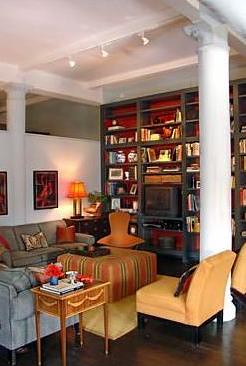 Painted interior bookshelves: Gray + orange palette in NYC loft
