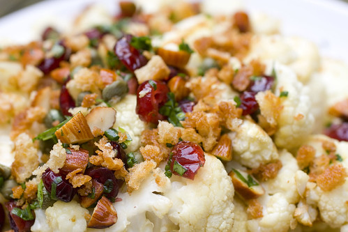 close up on Cauliflower, Almonds, Craisins, and capers