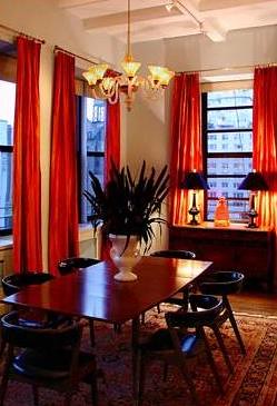Mid-century modern table + chairs + orange curtains
