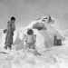 People outside of Moosa's igloo, Research Station, Kimmirut, Baffin Island, Nunavut / Des gens à l’extérieur de l’igloo de Moosa, station de recherche, à Kimmirut, sur l’île de Baffin (Nunavut)