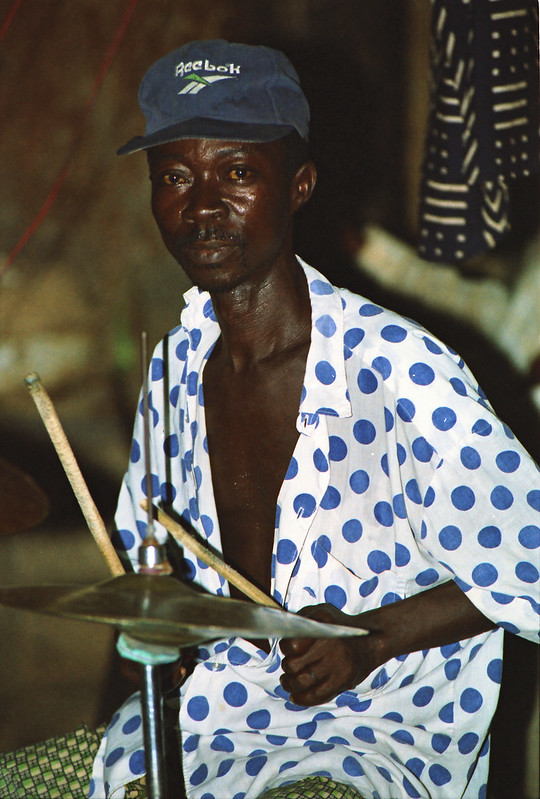 Togo West Africa Local Ethnic Cultural Orchestra Band and Show African Village close to Palimé formerly known as Kpalimé a city in Plateaux Region Togo near the Ghanaian border 23 April 1999 109<br/>© <a href="https://flickr.com/people/41087279@N00" target="_blank" rel="nofollow">41087279@N00</a> (<a href="https://flickr.com/photo.gne?id=13956802696" target="_blank" rel="nofollow">Flickr</a>)