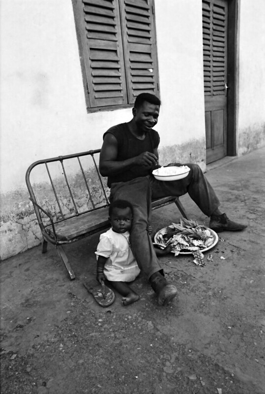 Togo West Africa Togolese African Father and Daughter Village close to Palimé formerly known as Kpalimé is a city in Plateaux Region Togo near the Ghanaian border B&W 23 April 1999 080<br/>© <a href="https://flickr.com/people/41087279@N00" target="_blank" rel="nofollow">41087279@N00</a> (<a href="https://flickr.com/photo.gne?id=13924945041" target="_blank" rel="nofollow">Flickr</a>)