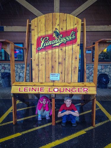 It was pouring rain but the kids still wanted to get a photo of themselves with the largest Leinenkugels Lounger in all of Burnett County. • <a style="font-size:0.8em;" href="http://www.flickr.com/photos/96277117@N00/14690978725/" target="_blank">View on Flickr</a>