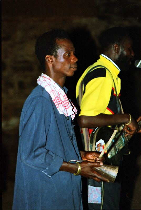 Togo West Africa Local Ethnic Cultural Orchestra Band and Show African Village close to Palimé formerly known as Kpalimé a city in Plateaux Region Togo near the Ghanaian border 23 April 1999 114<br/>© <a href="https://flickr.com/people/41087279@N00" target="_blank" rel="nofollow">41087279@N00</a> (<a href="https://flickr.com/photo.gne?id=13976703431" target="_blank" rel="nofollow">Flickr</a>)