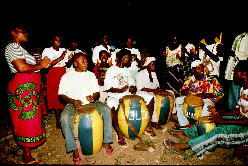 Togo West Africa Ethnic Cultural Dancing and Drumming African Village close to Palimé formerly known as Kpalimé a city in Plateaux Region Togo near the Ghanaian border 24 April 1999 123 Fouzia Drumming<br/>© <a href="https://flickr.com/people/41087279@N00" target="_blank" rel="nofollow">41087279@N00</a> (<a href="https://flickr.com/photo.gne?id=13984381112" target="_blank" rel="nofollow">Flickr</a>)