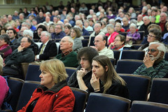 Audience listens intently