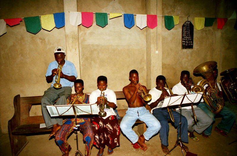 Togo West Africa Local Ethnic Cultural Orchestra Band and Show African Village close to Palimé formerly known as Kpalimé a city in Plateaux Region Togo near the Ghanaian border 23 April 1999 042 Local Brass Band<br/>© <a href="https://flickr.com/people/41087279@N00" target="_blank" rel="nofollow">41087279@N00</a> (<a href="https://flickr.com/photo.gne?id=13906799901" target="_blank" rel="nofollow">Flickr</a>)
