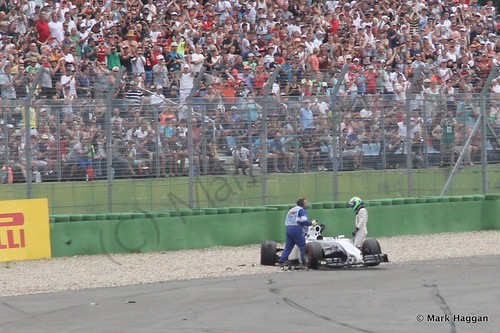 Felipe Massa gets out of his car after his first lap crash at the 2014 German Grand Prix